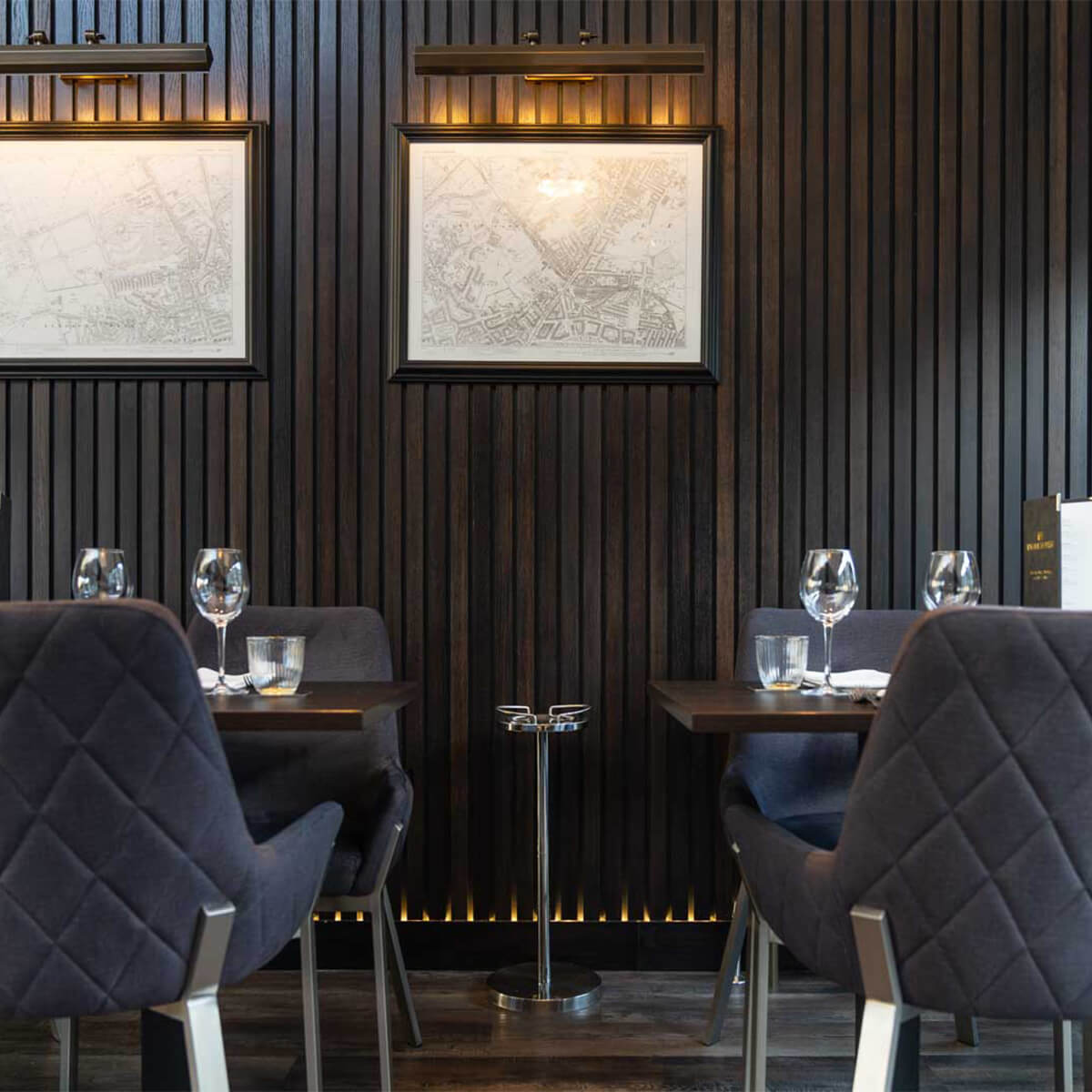 Private dining room at The Tollhouse with dark wood paneling for upscale events.