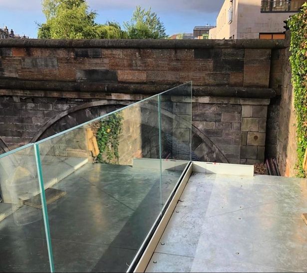 Modern outdoor terrace with glass railing, perfect for networking receptions and gatherings.