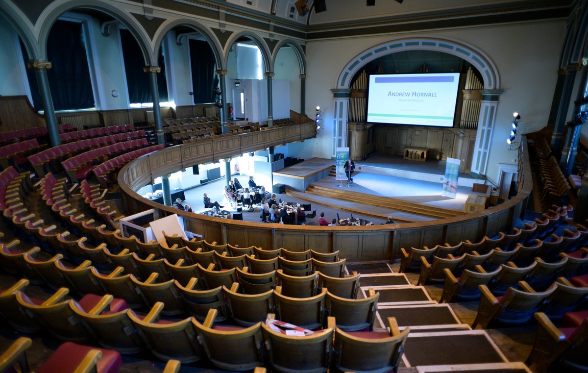 Spacious auditorium with tiered seating for conferences and events in Central Venues.