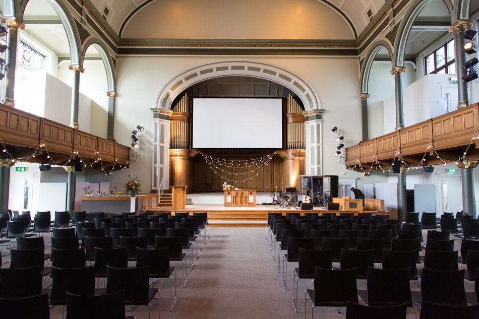 Spacious auditorium with flexible seating for presentations and events in Central Venues.
