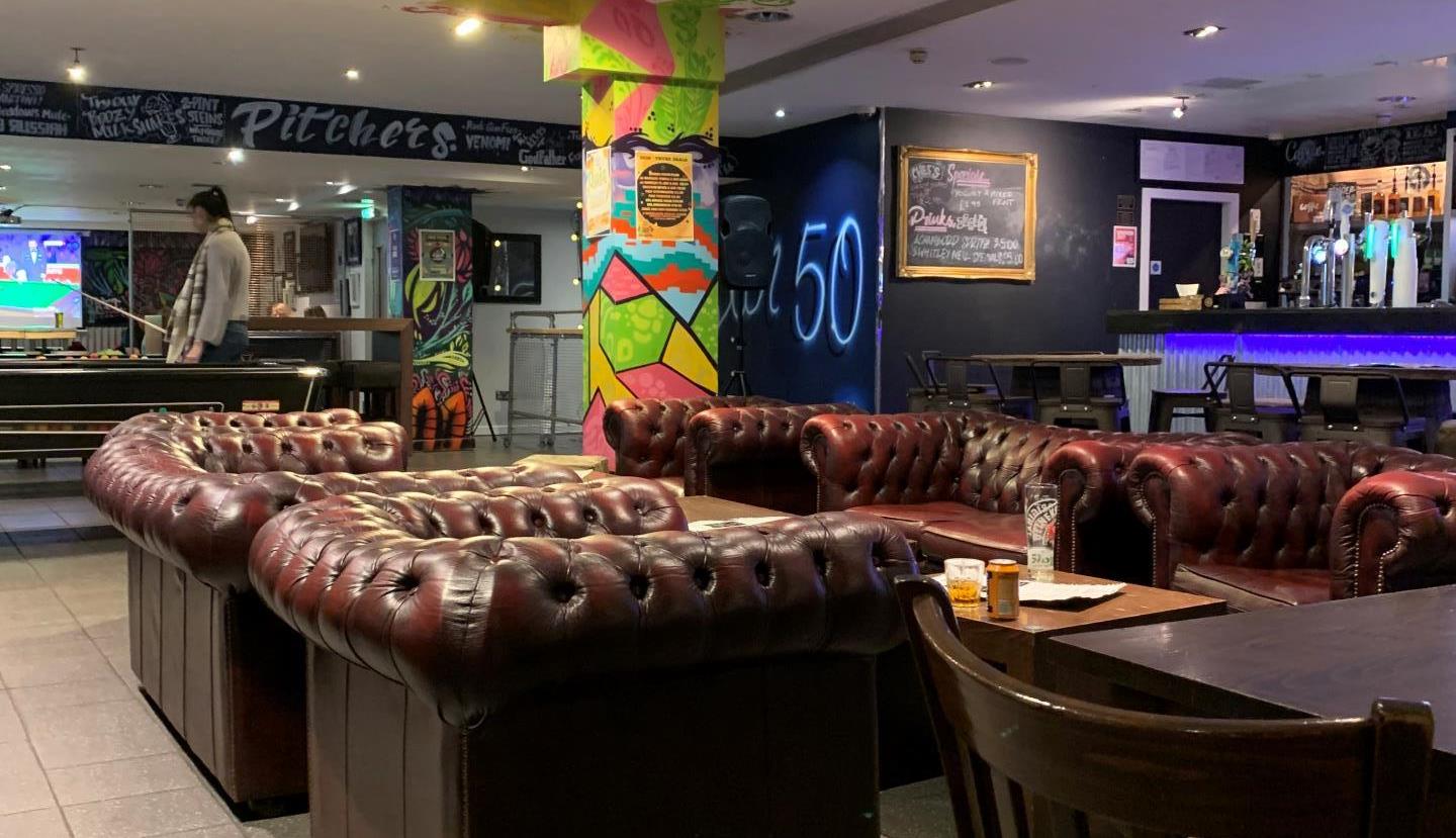 Bar 50 beer garden with Chesterfield sofas for corporate networking and team-building events.
