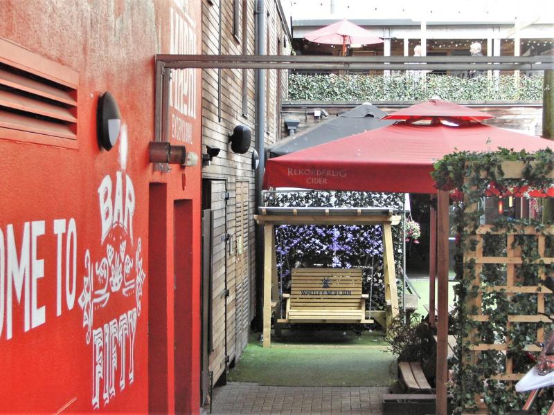Rustic Bar 50 beer garden courtyard for networking events and corporate happy hours.