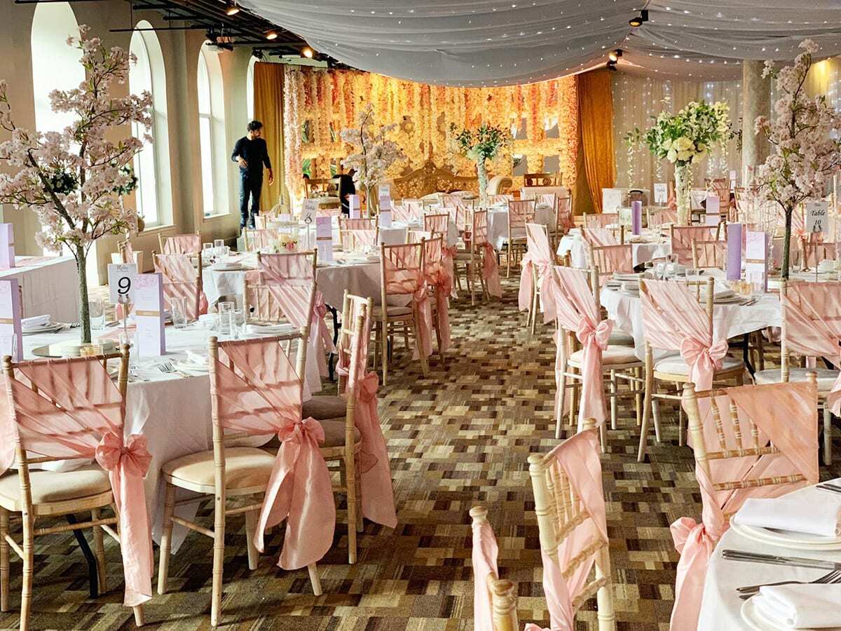 Elegant event space with floral centerpieces for weddings and formal celebrations.