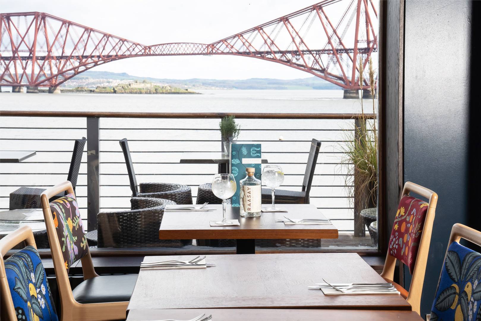 Stylish Orocco Pier dining area with bridge view, perfect for events and gatherings.