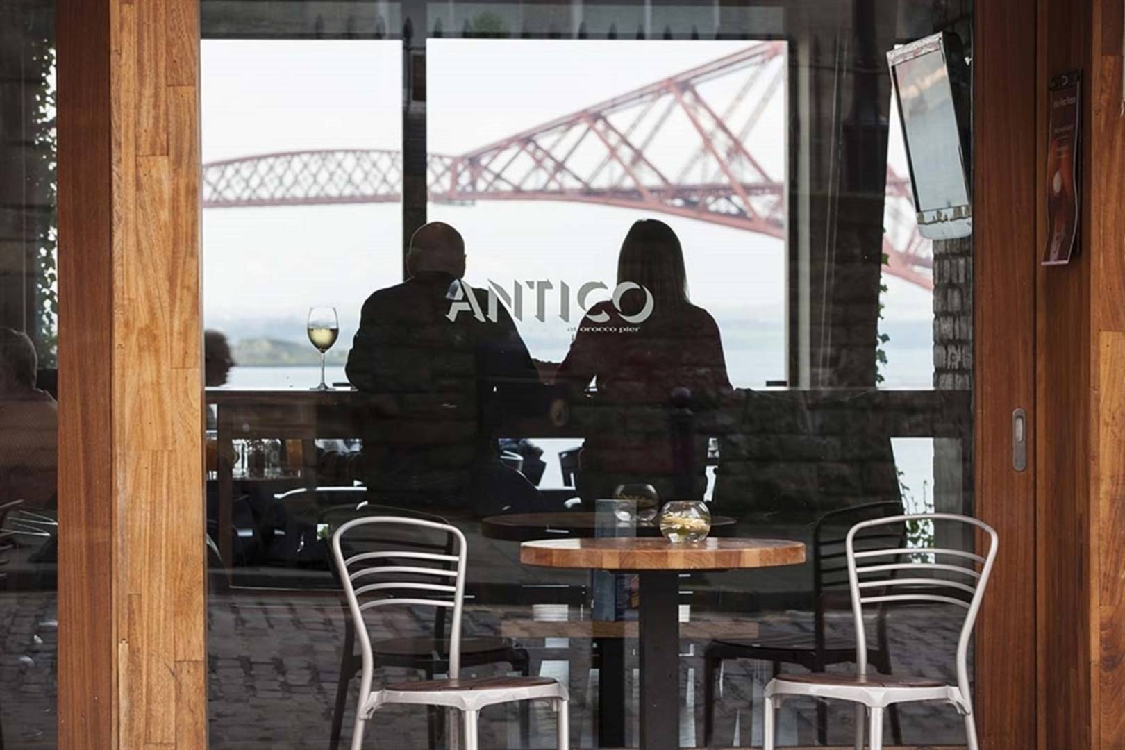 Cozy Orocco Pier bar with glass facade, perfect for networking events and meetings.