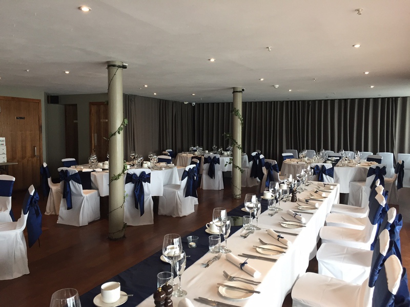 Elegant event space at Orocco Pier with navy blue accents, perfect for weddings and corporate events.