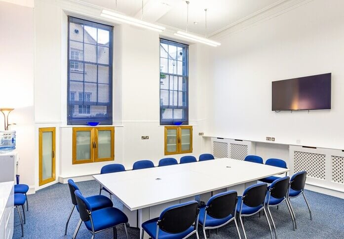 Interview Room at Capital Business Centre with large table, ideal for meetings and presentations.
