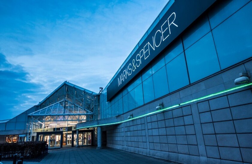 Modern meeting room entrance with glass facade, ideal for corporate events and gatherings.