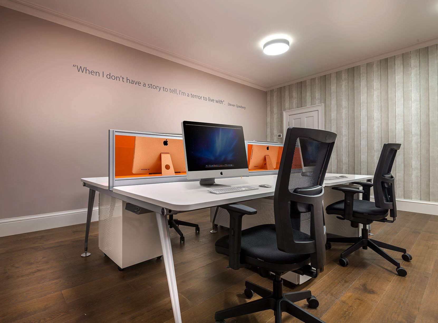 Modern serviced office workspace with sleek desks, ideal for team meetings and collaboration.