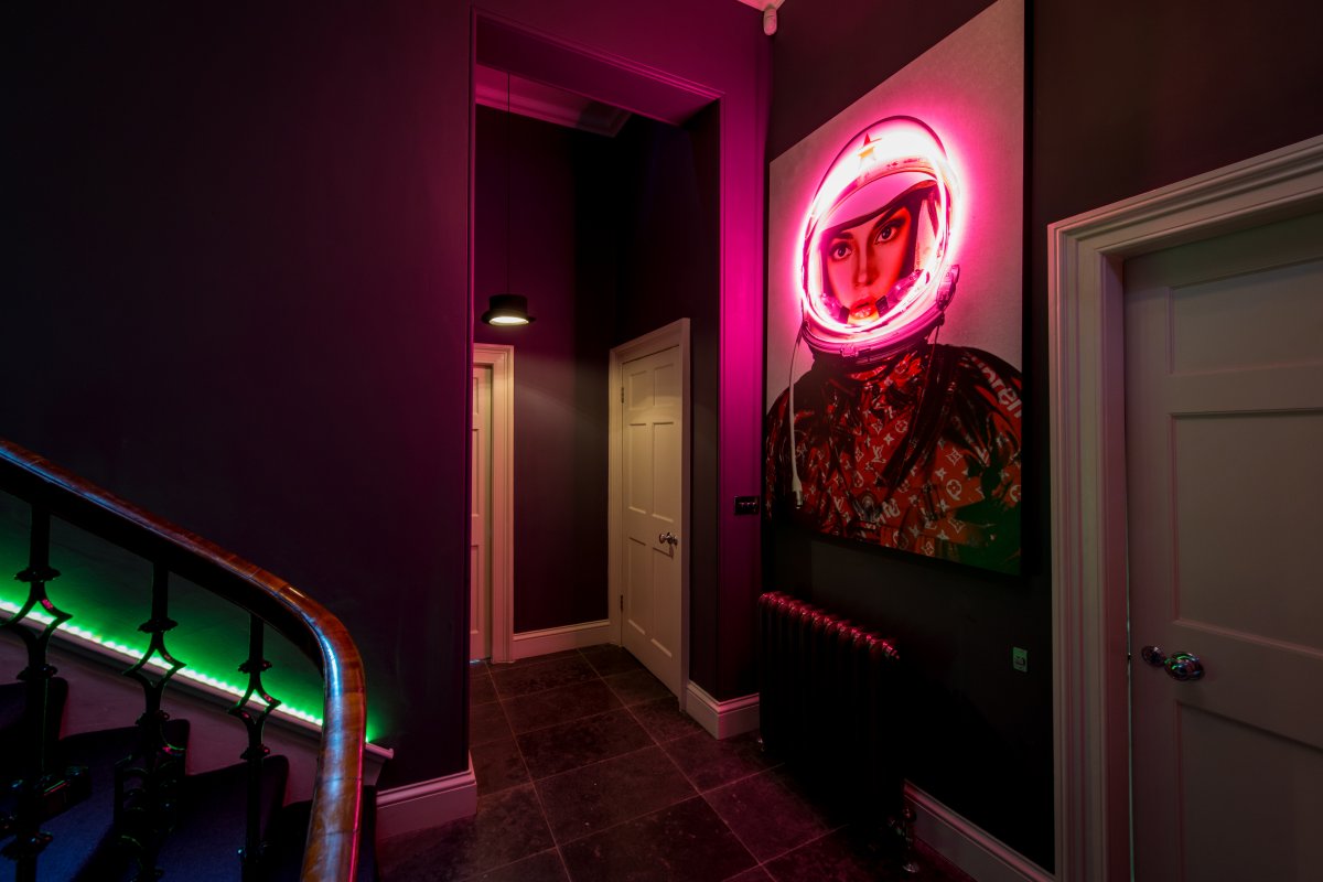 Vibrant entrance of The Skyhook with astronaut artwork, ideal for creative events.