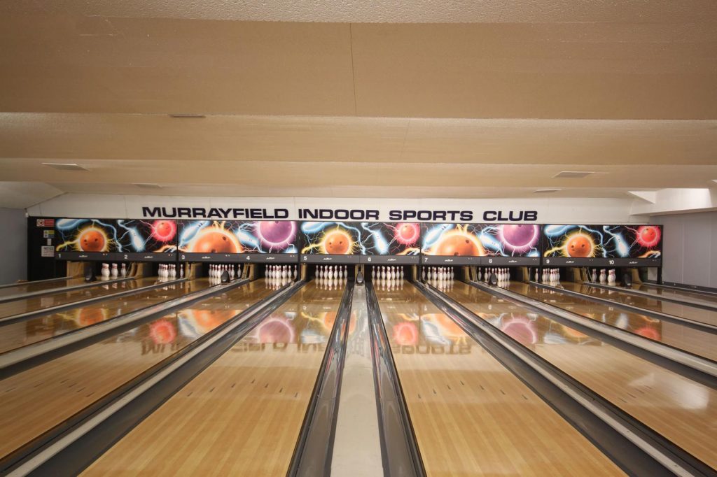 Vibrant bowling alley at Murrayfield Indoor Sports Club for corporate events and team-building.