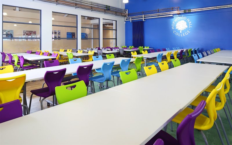 Vibrant conference suite with colorful chairs for workshops at Hopwood Hall College.