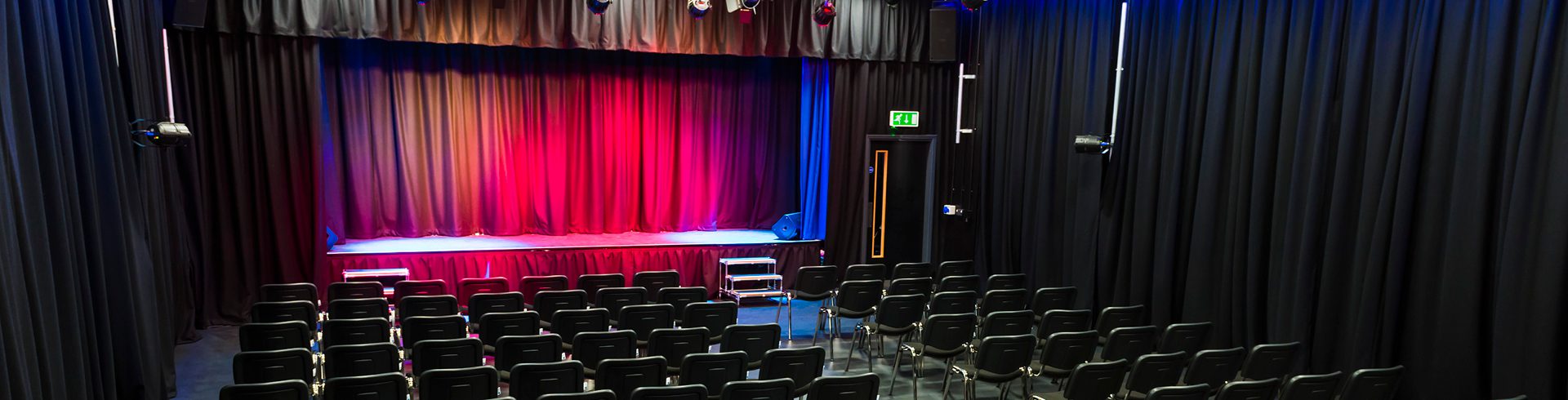 Lecture theatre at Hopwood Hall College, vibrant lighting, ideal for presentations and workshops.