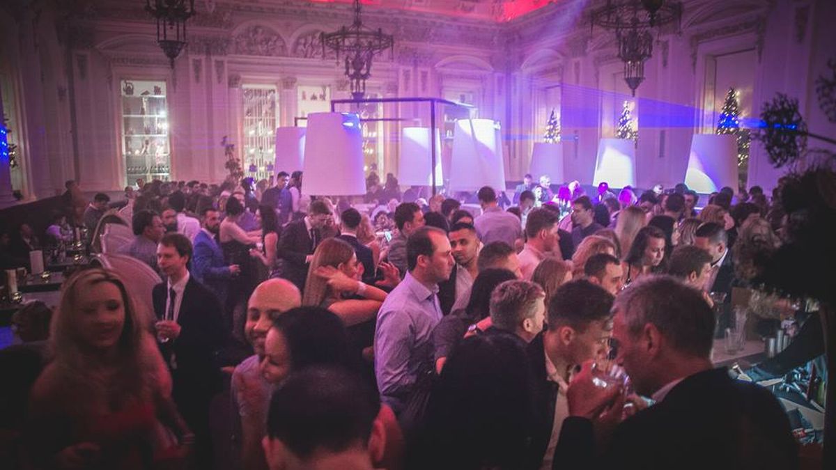 Vibrant Live Nightclub event at The Corinthian Club with dramatic lighting and networking.
