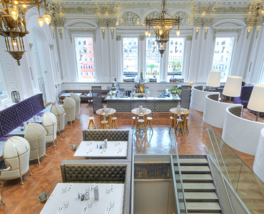 Elegant private event space at The Corinthian Club with plush seating and stylish bar.