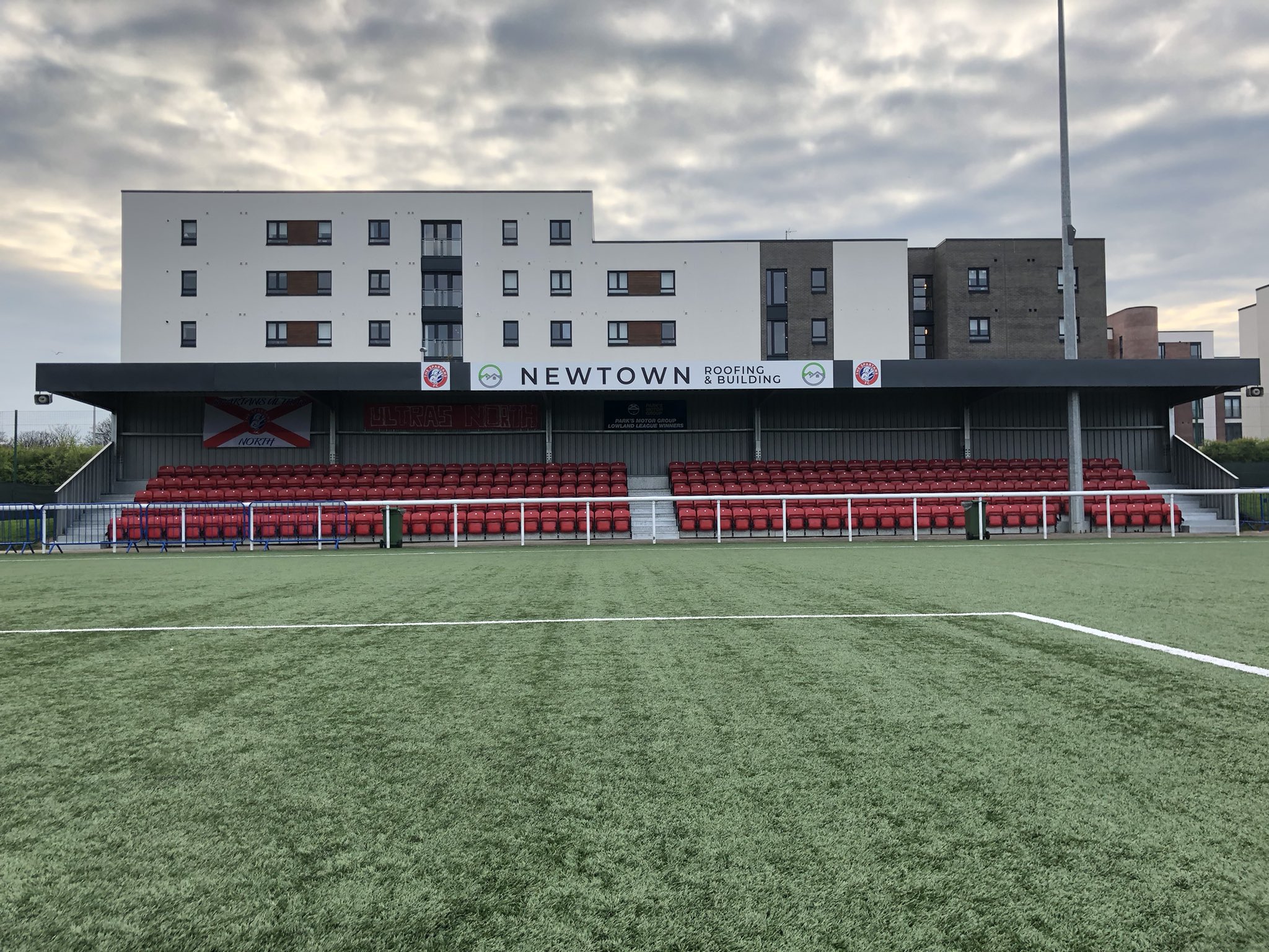 Newtown Roofing and Building Stand at Ainslie Park Stadium, ideal for outdoor events.