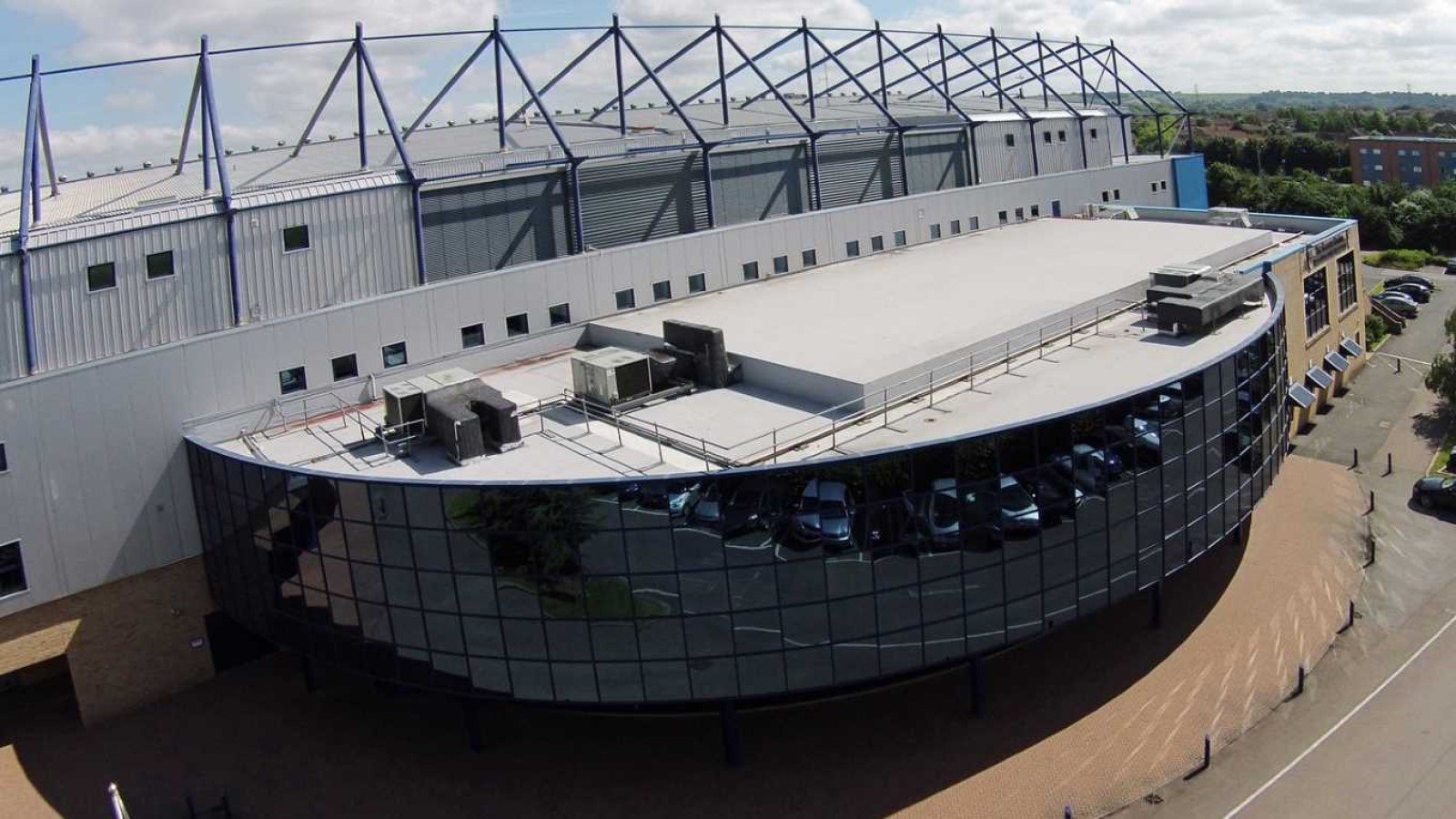Christchurch Suite at Kassam Stadium, modern venue with large windows for conferences.
