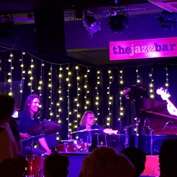 Live music stage with twinkling lights at The Jazz Bar for events and entertainment.