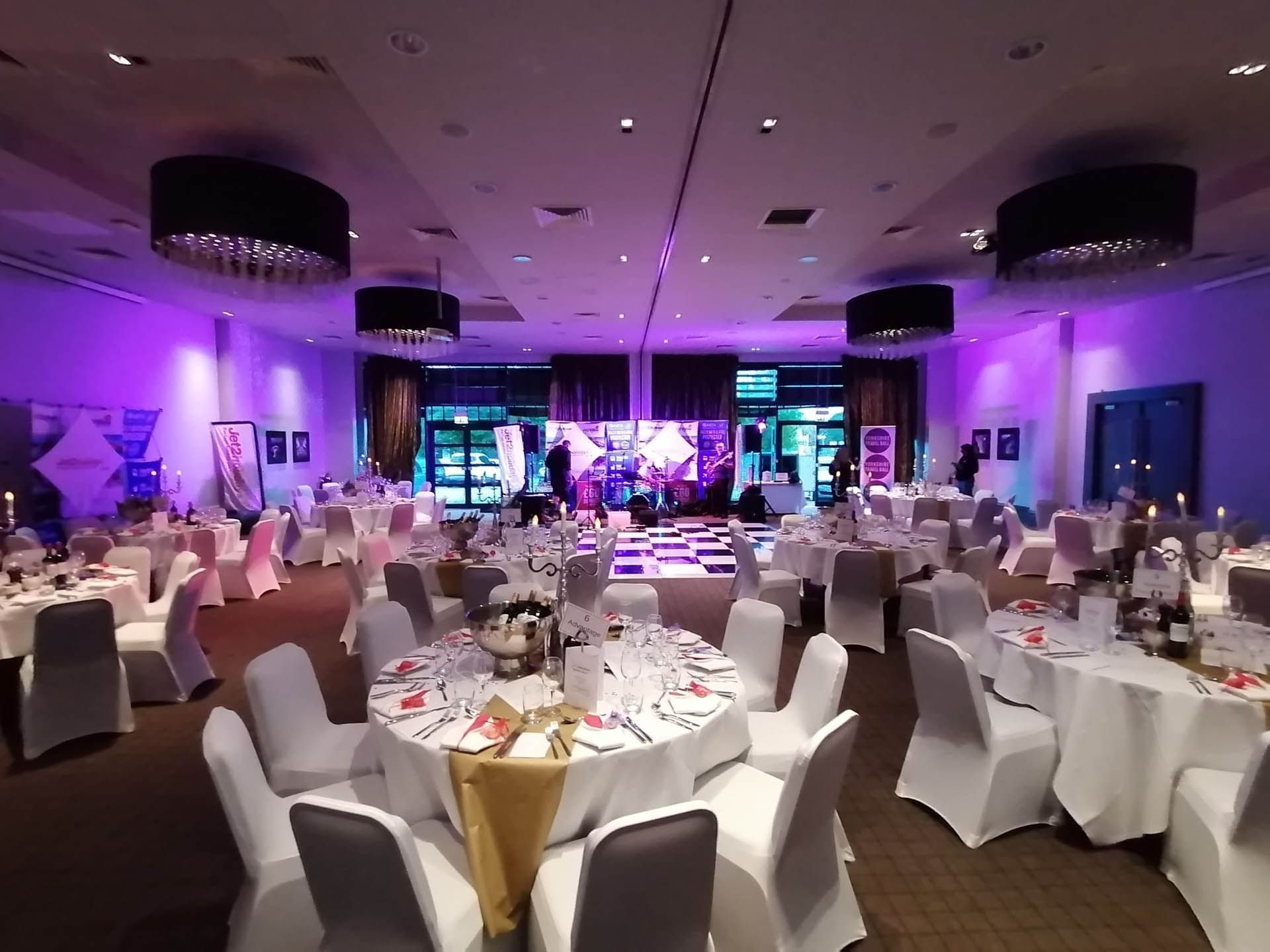 Elegant event space at Village Hotel Edinburgh, set for a formal dinner gala.