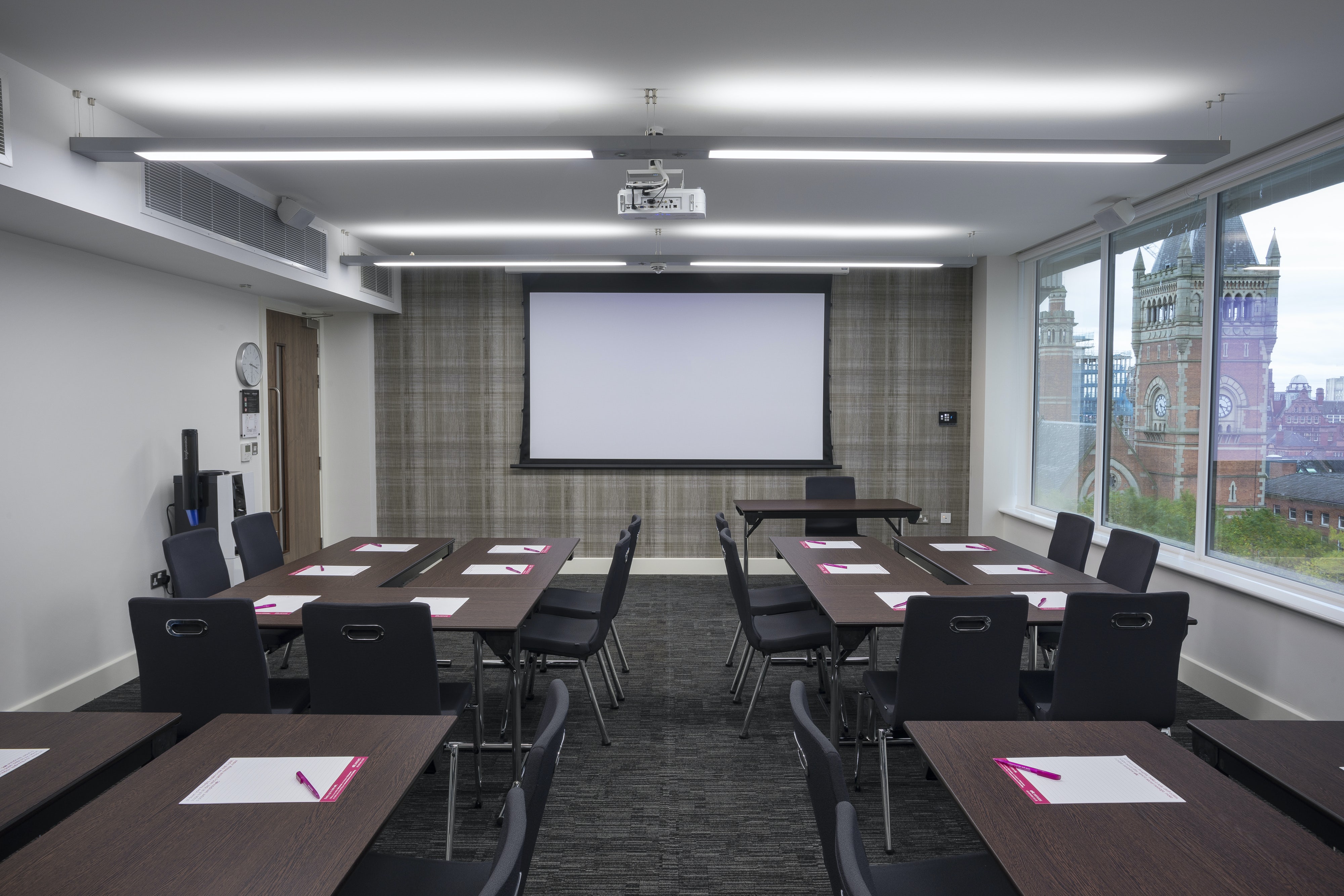 Modern meeting room in Etc.venues Manchester, ideal for workshops and presentations.