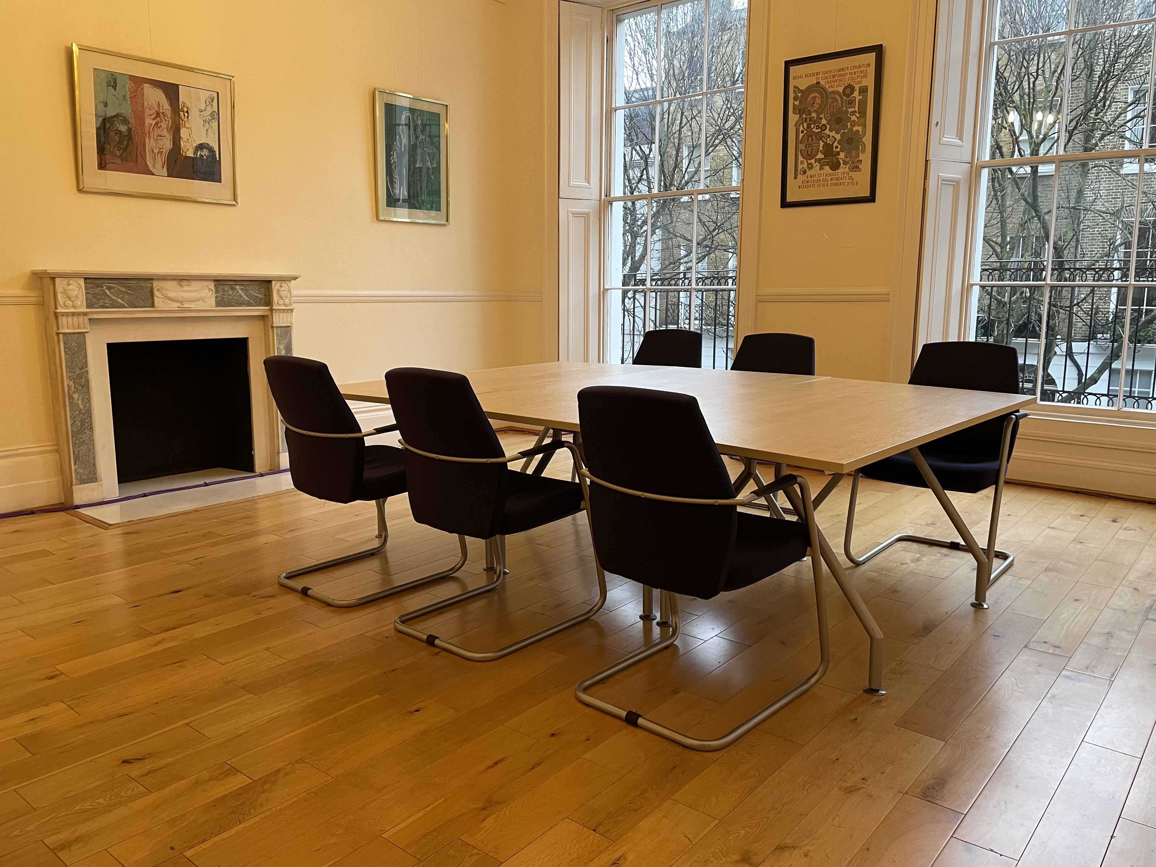 Meeting room in historic Bloomsbury building, featuring a large minimalist table for workshops.