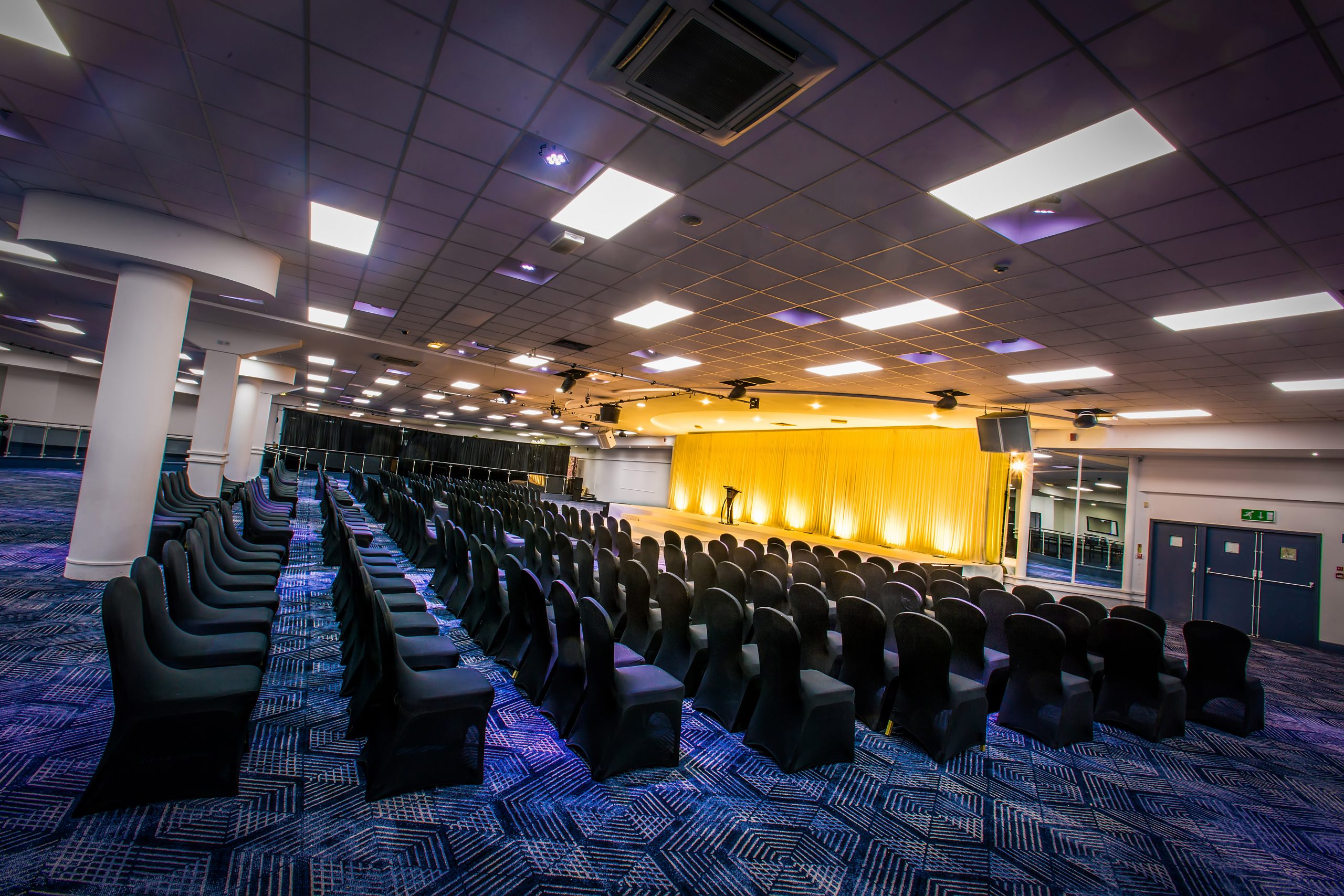 Conference Suite at The Sheridan with black chairs, ideal for presentations and events.
