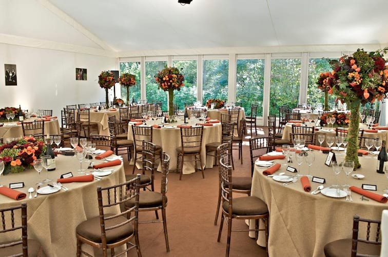 Elegant conference suite with floral centerpieces, ideal for weddings and corporate events.