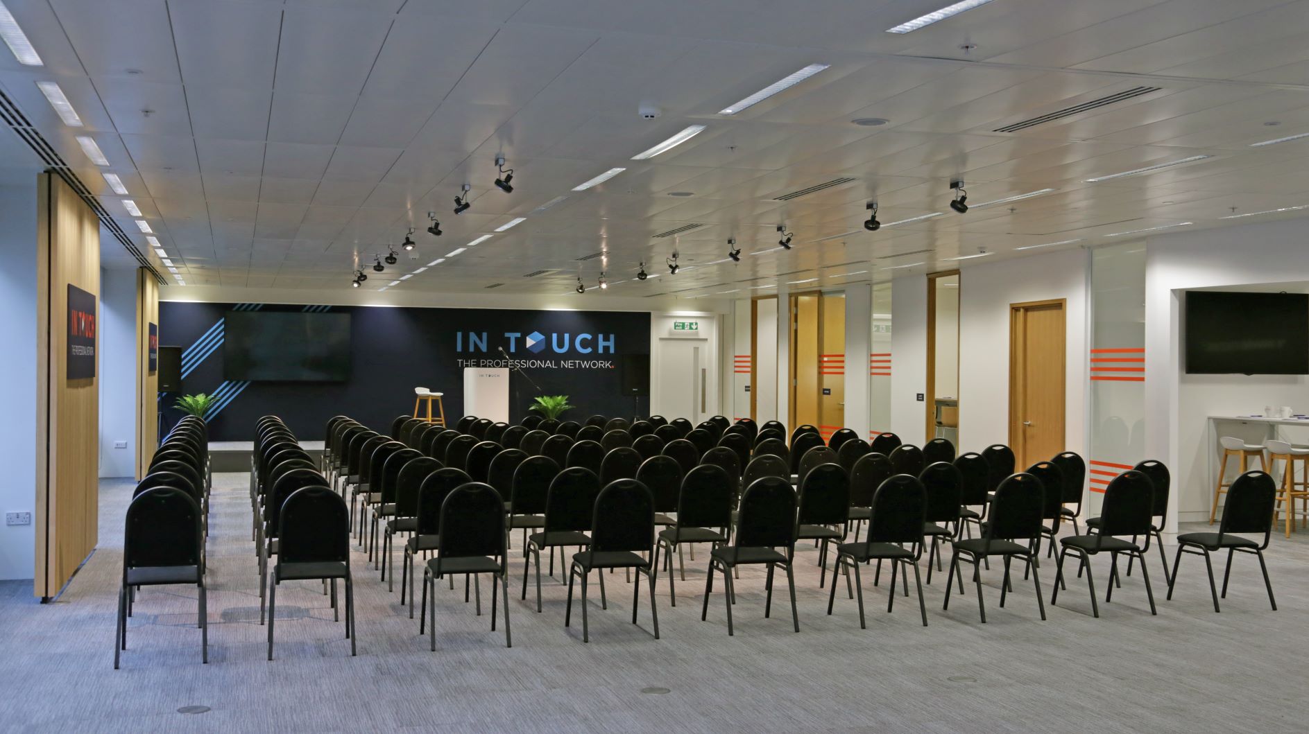 Manchester Central meeting space with black chairs for conferences and workshops.