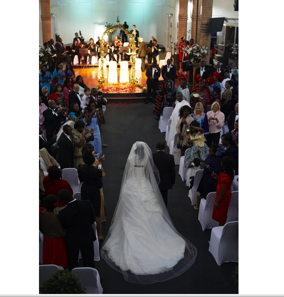 Wedding ceremony at Diamond Arena, featuring floral altar and elegant seating arrangement.