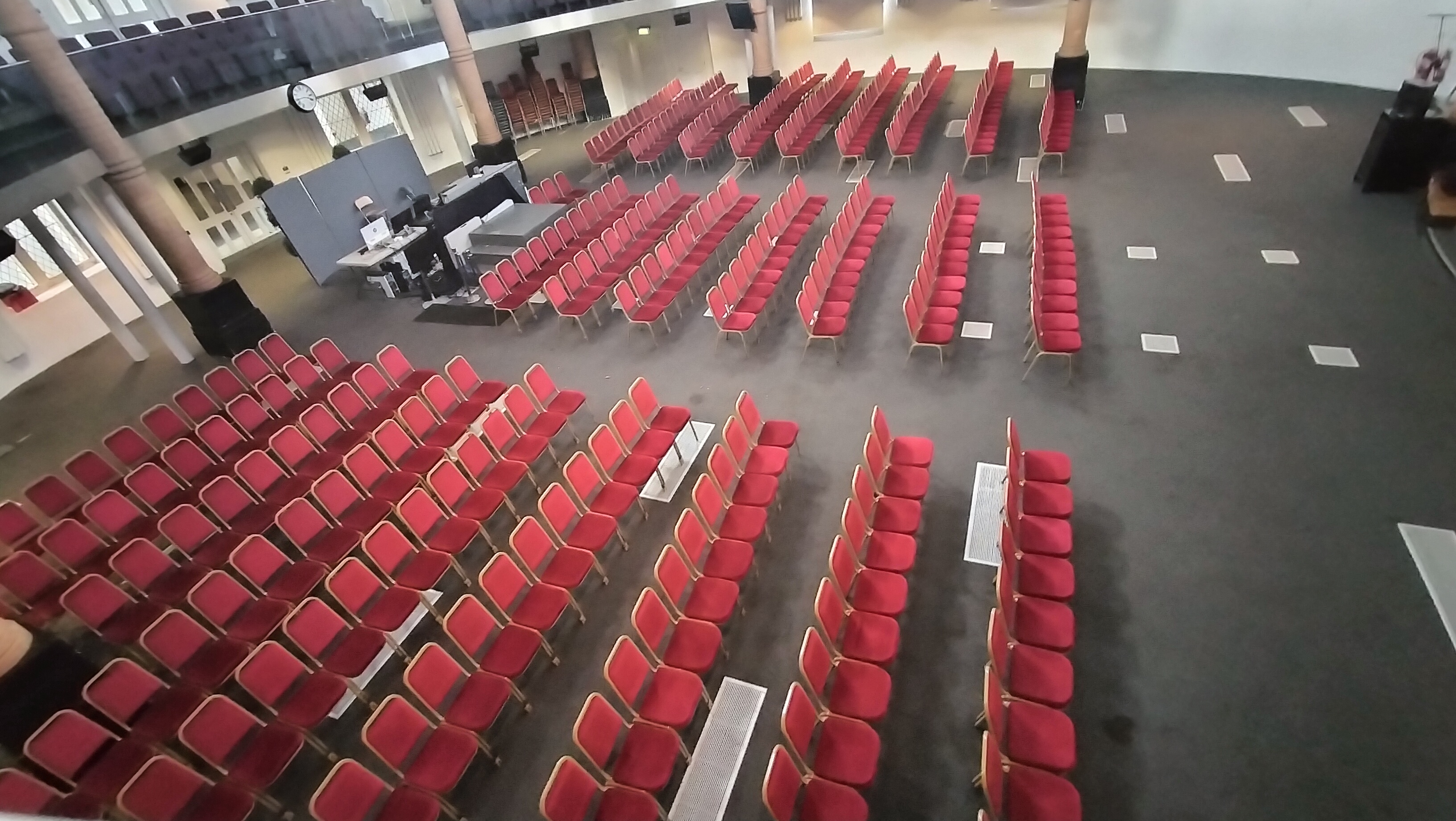 Diamond Arena event space with red chairs, ideal for conferences and presentations.