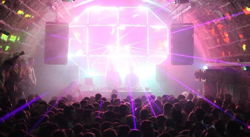 Vibrant event space with laser lights, perfect for music events and nightlife.
