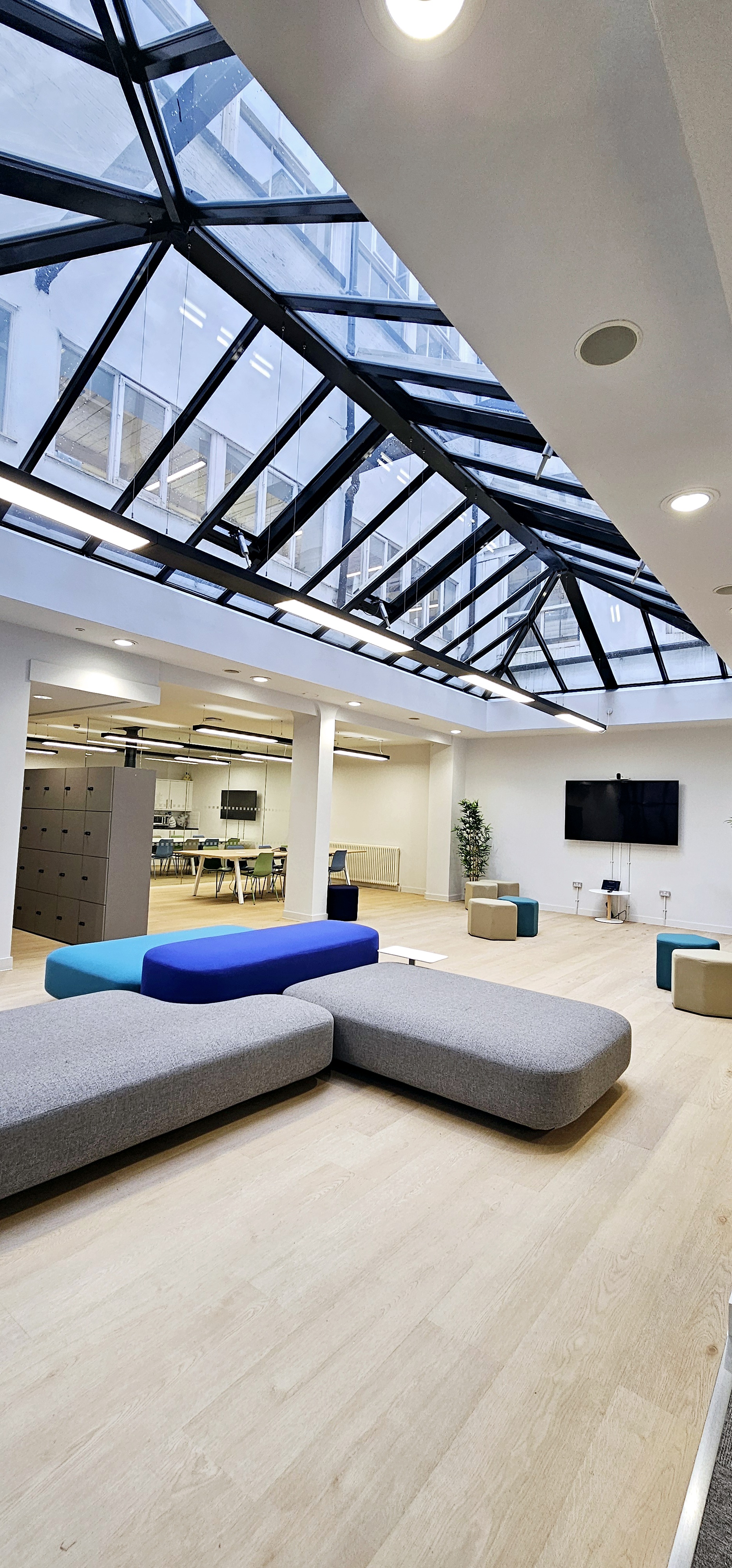 Modern event space in ZEBOX UK with skylight, ideal for meetings and gatherings.