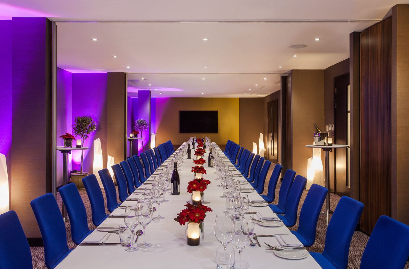 Elegant formal dinner setup with poinsettias at Marlowe's Second Floor Exclusive.