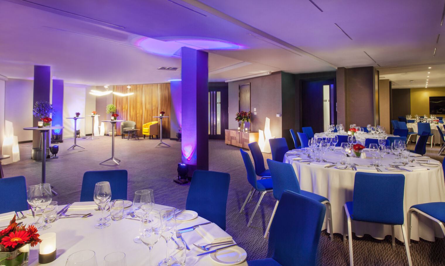 Sophisticated event space with round tables, ideal for corporate meetings and social gatherings.