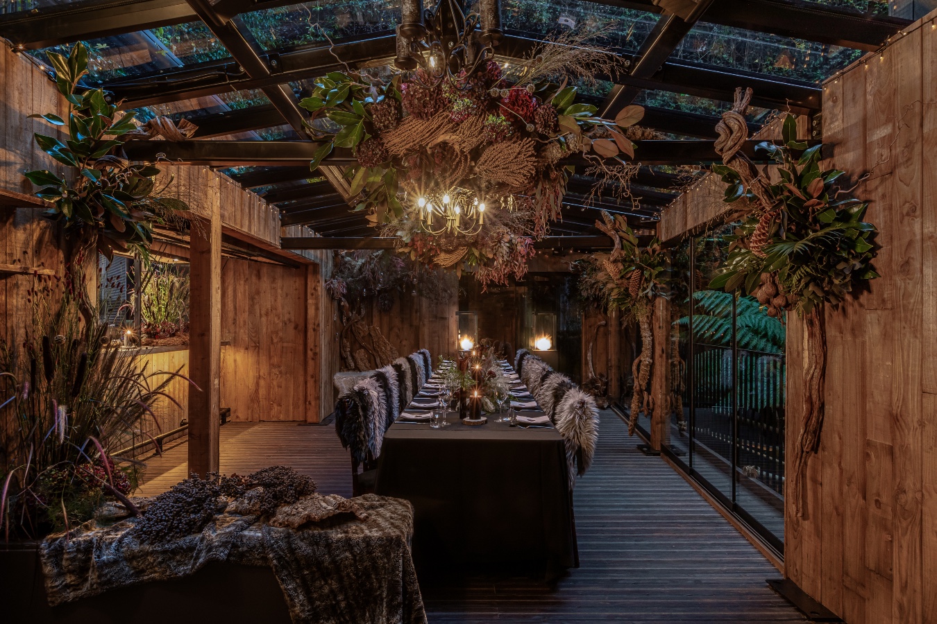 Elegant dining table under glass canopy for upscale events and intimate gatherings.