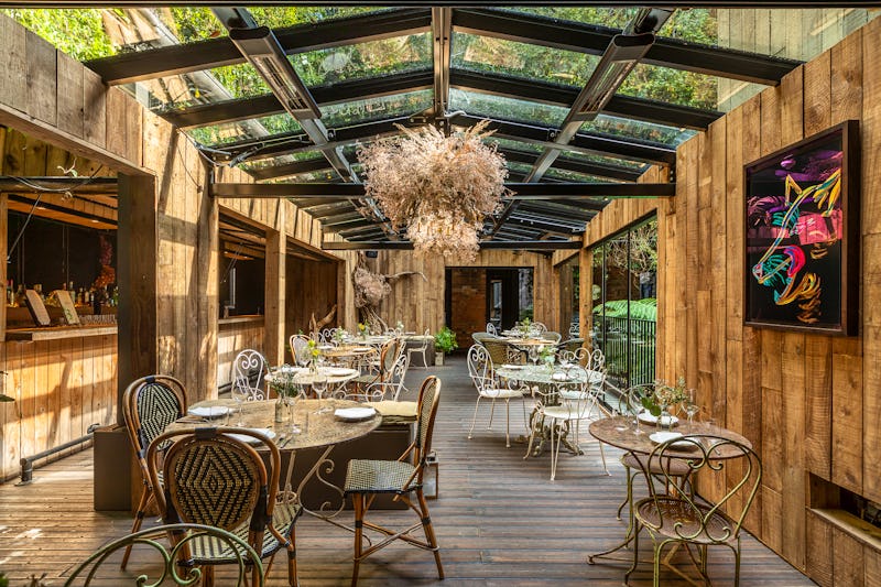 Jurema Winter Garden event space with glass ceiling, perfect for cocktail receptions and dinners.