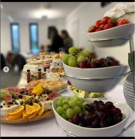 Emerald Suite buffet setup with fresh fruits for corporate events and networking.