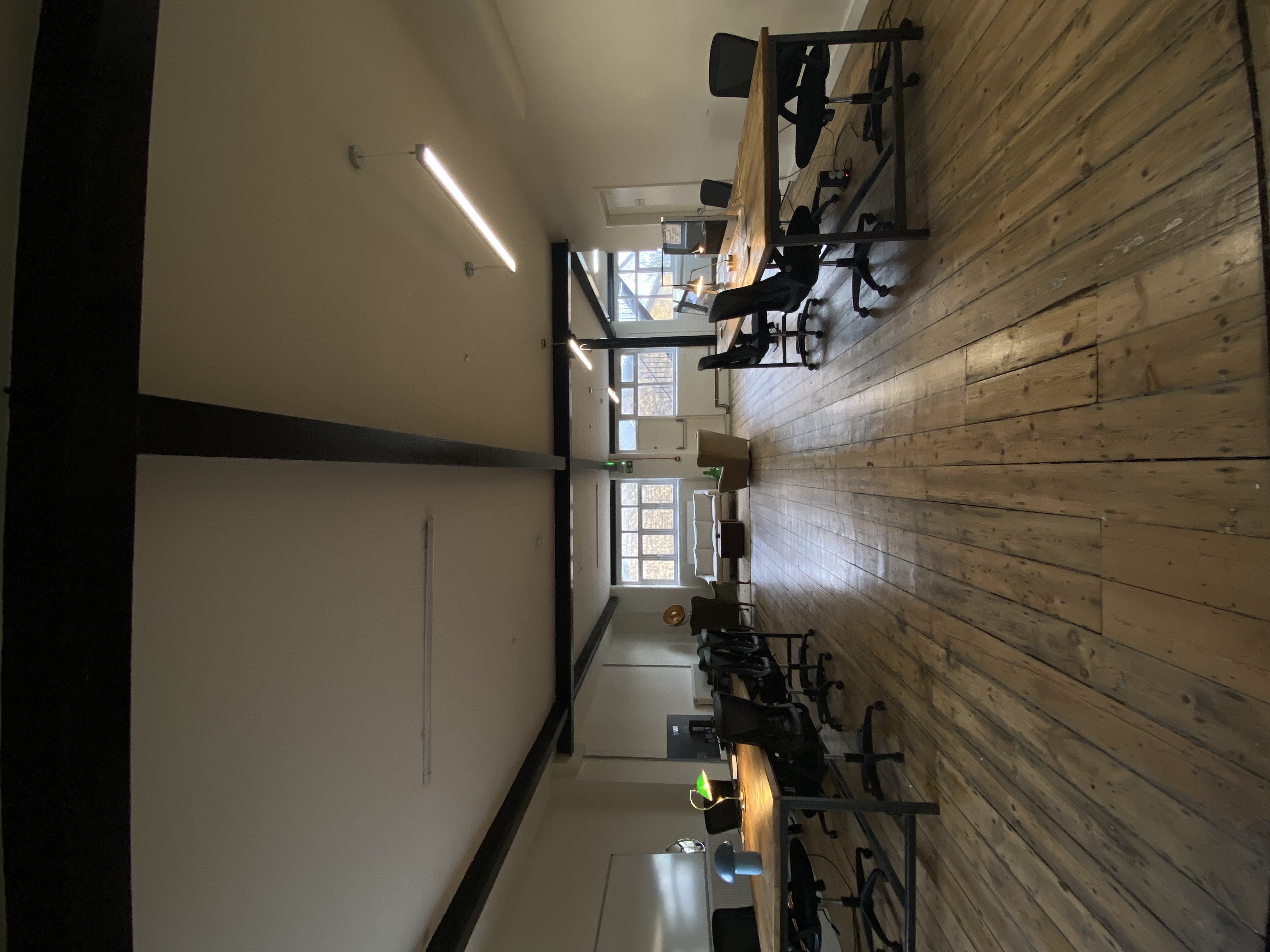 Spacious meeting room with ergonomic chairs for collaboration and brainstorming sessions.