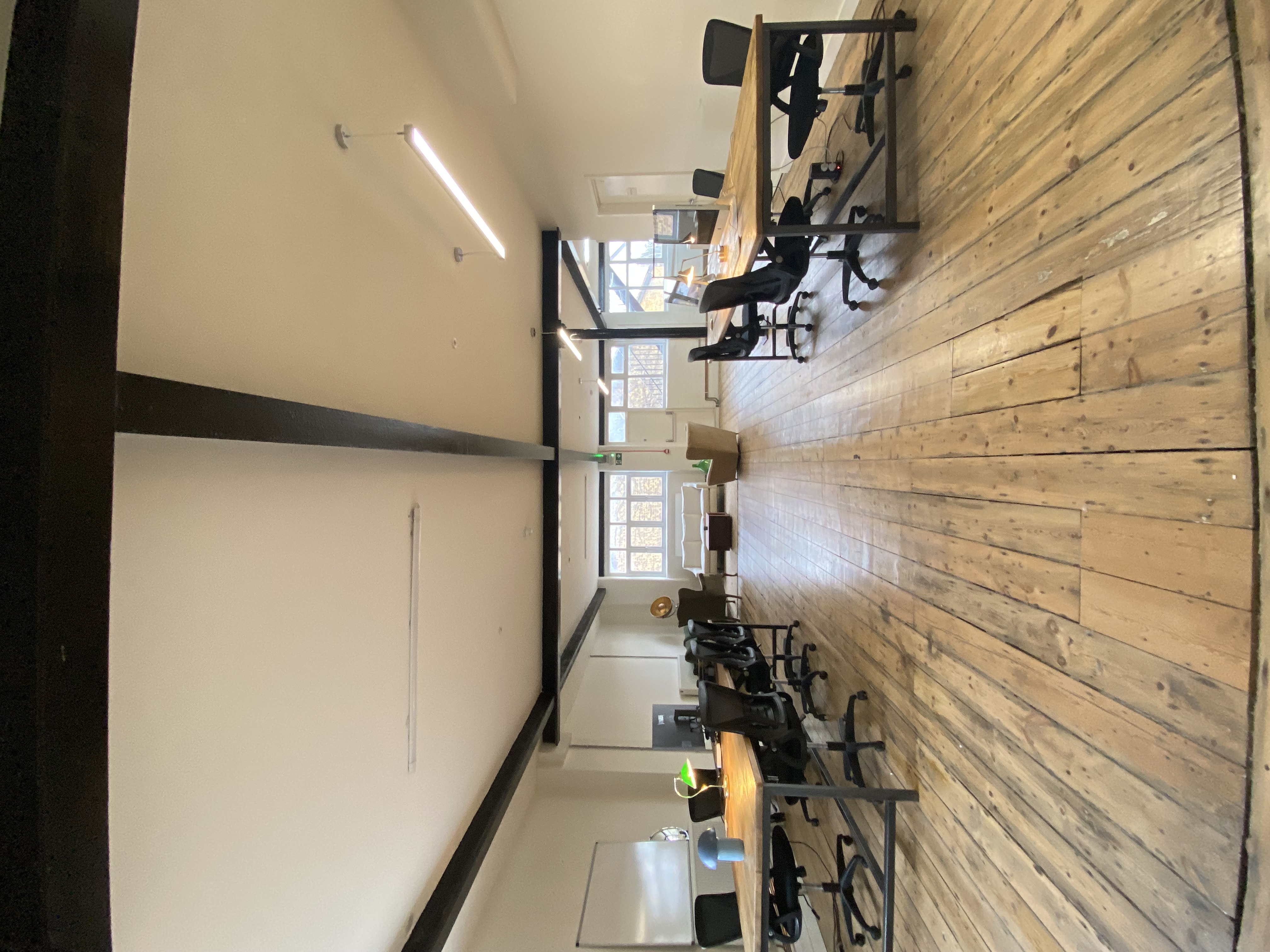 Spacious, well-lit office in Open X Space for meetings and events.