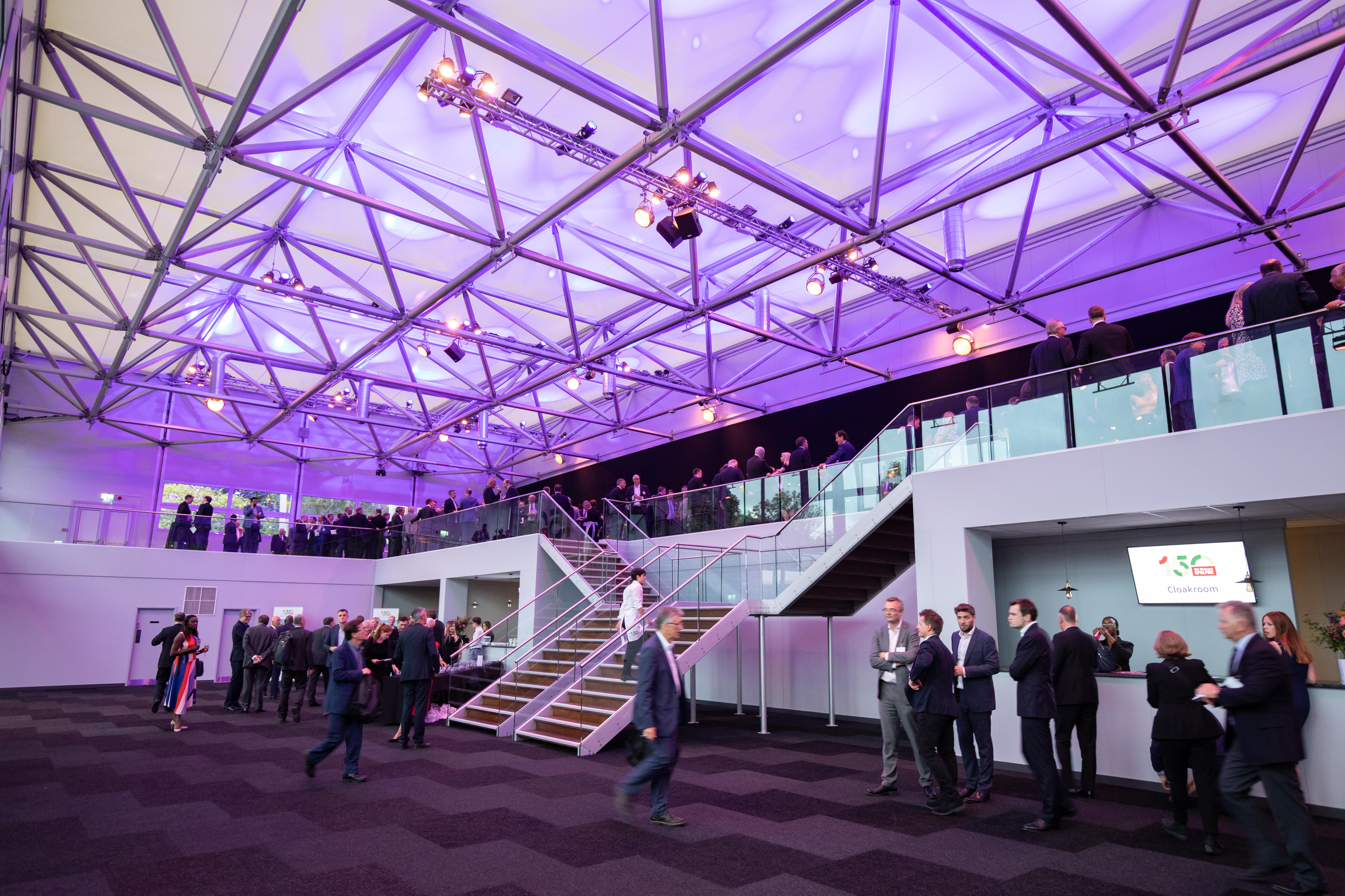 Modern event space in Evolution London with purple lighting for conferences and gatherings.