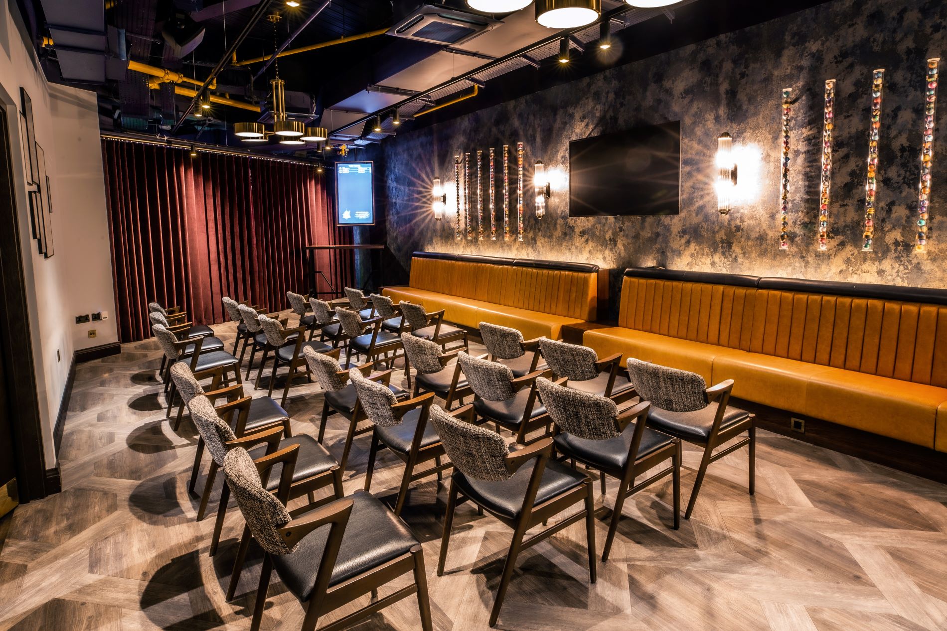 Modern meeting space at Puttshack Watford for workshops and presentations.