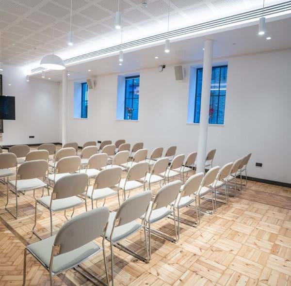 Wesleyan event space with bright design, ideal for seminars and presentations.