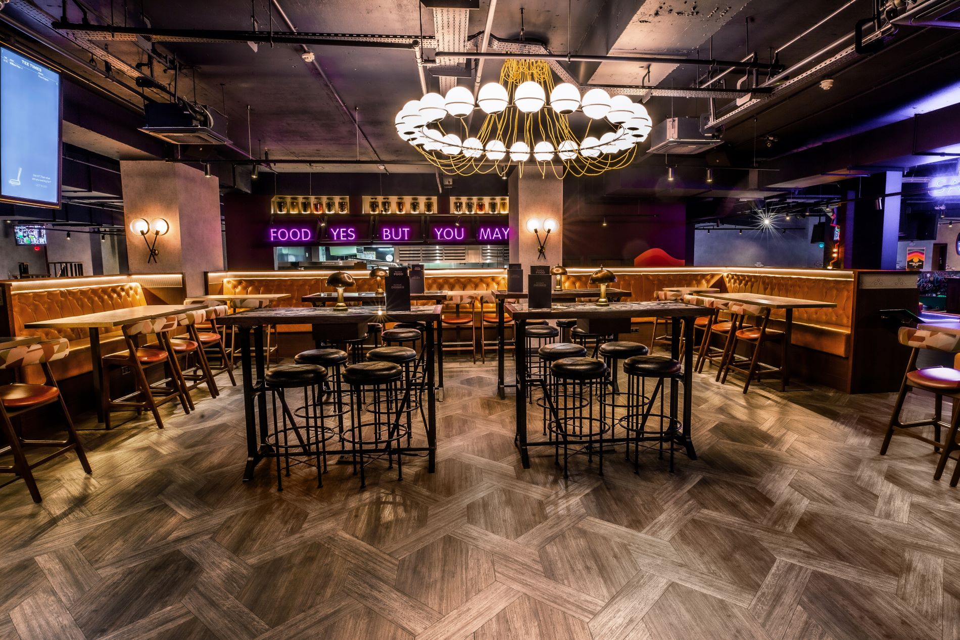 Ruby semi-private event space in Puttshack Watford with modern decor and flexible seating.