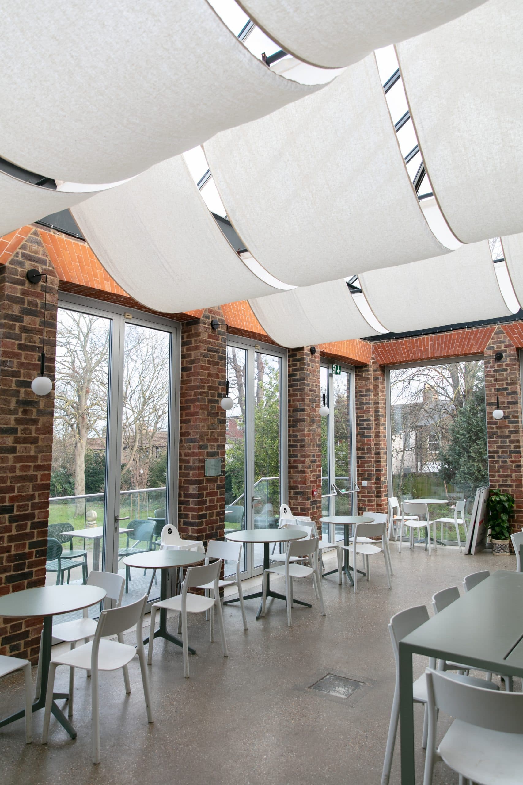 Bright event space with large windows at William Morris Gallery, perfect for meetings and gatherings.