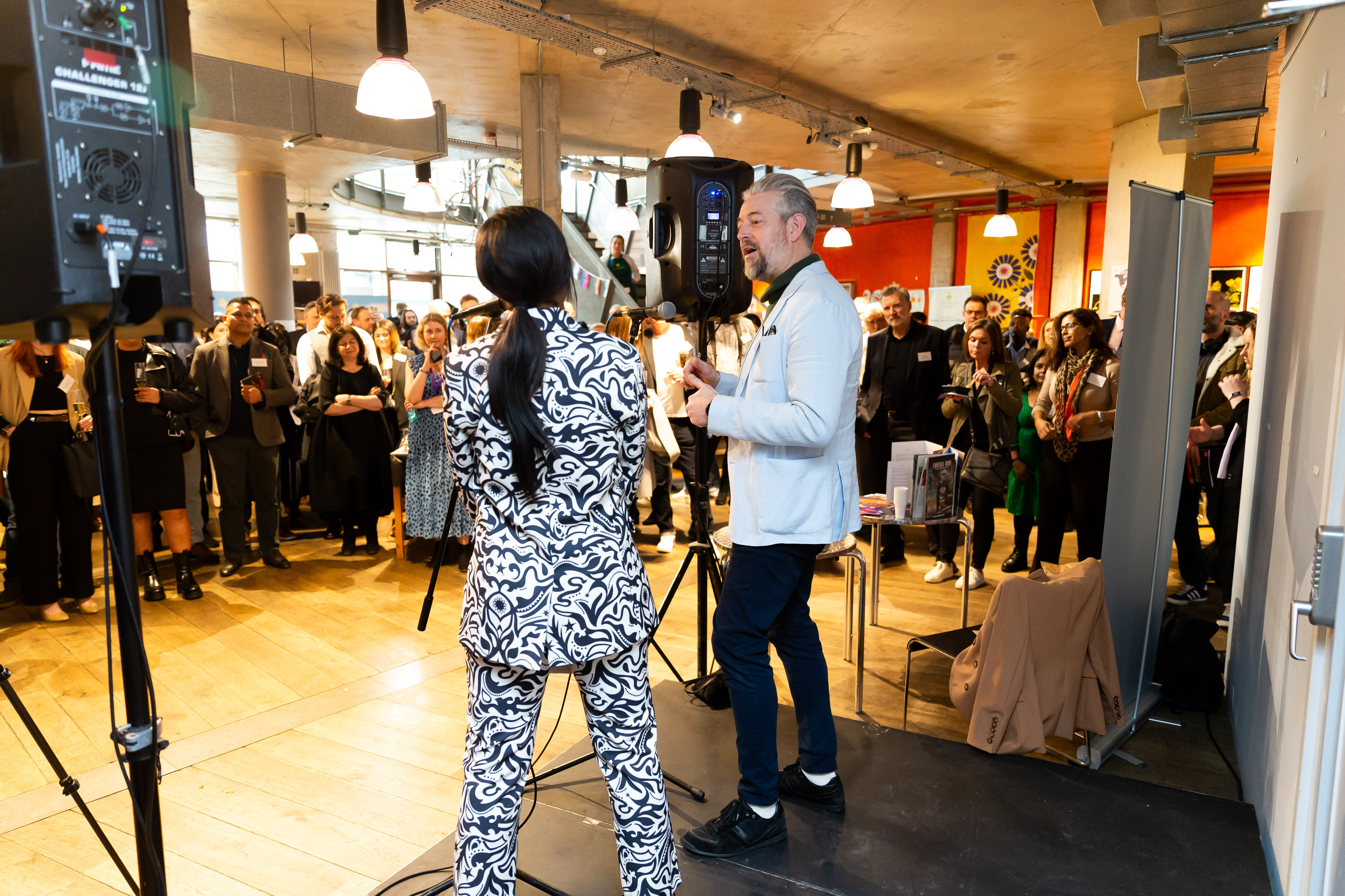 Networking event at The Rose Cafe with engaged attendees and vibrant ambiance.