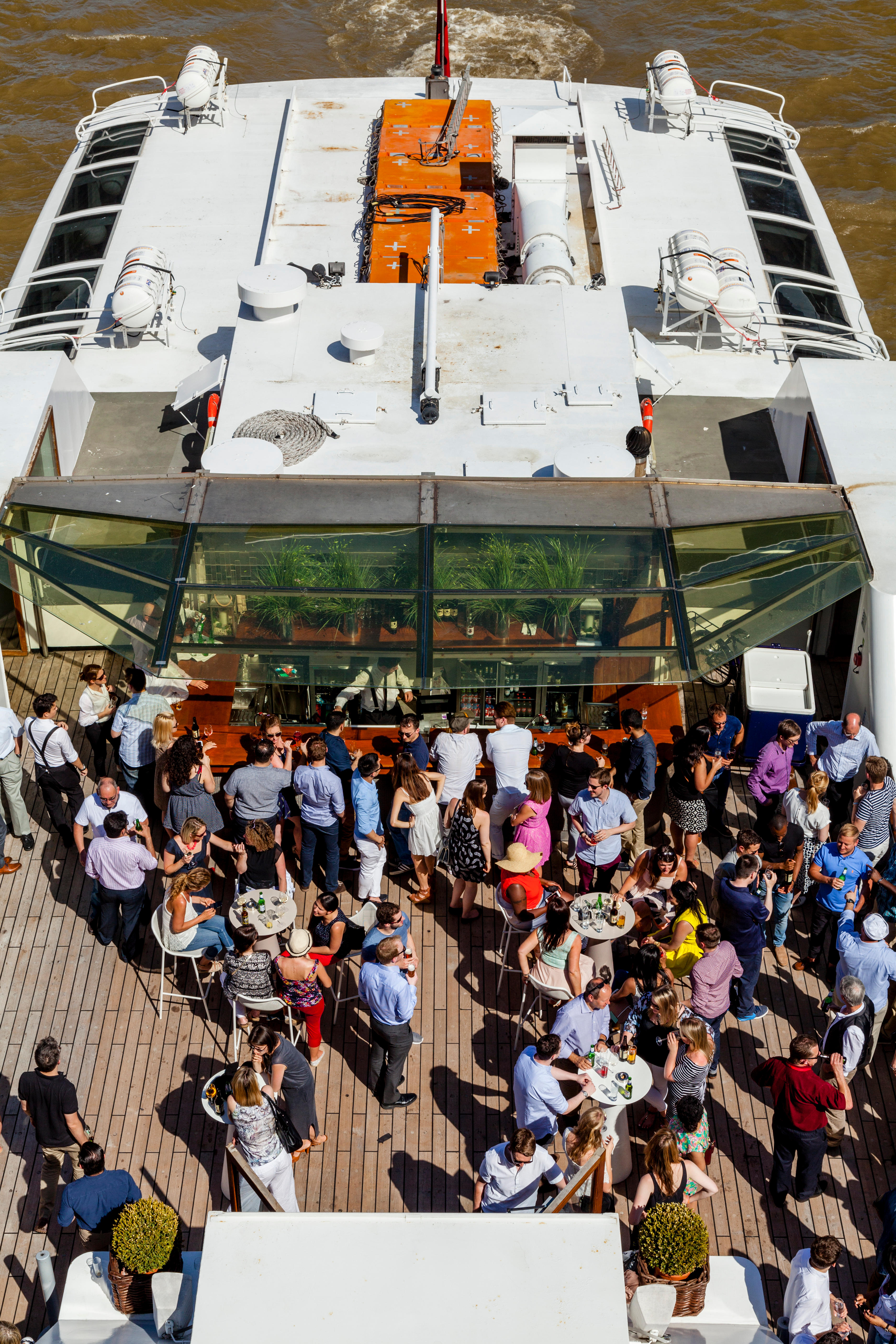 Silver Sturgeon outdoor event with attendees networking in a vibrant bar area.