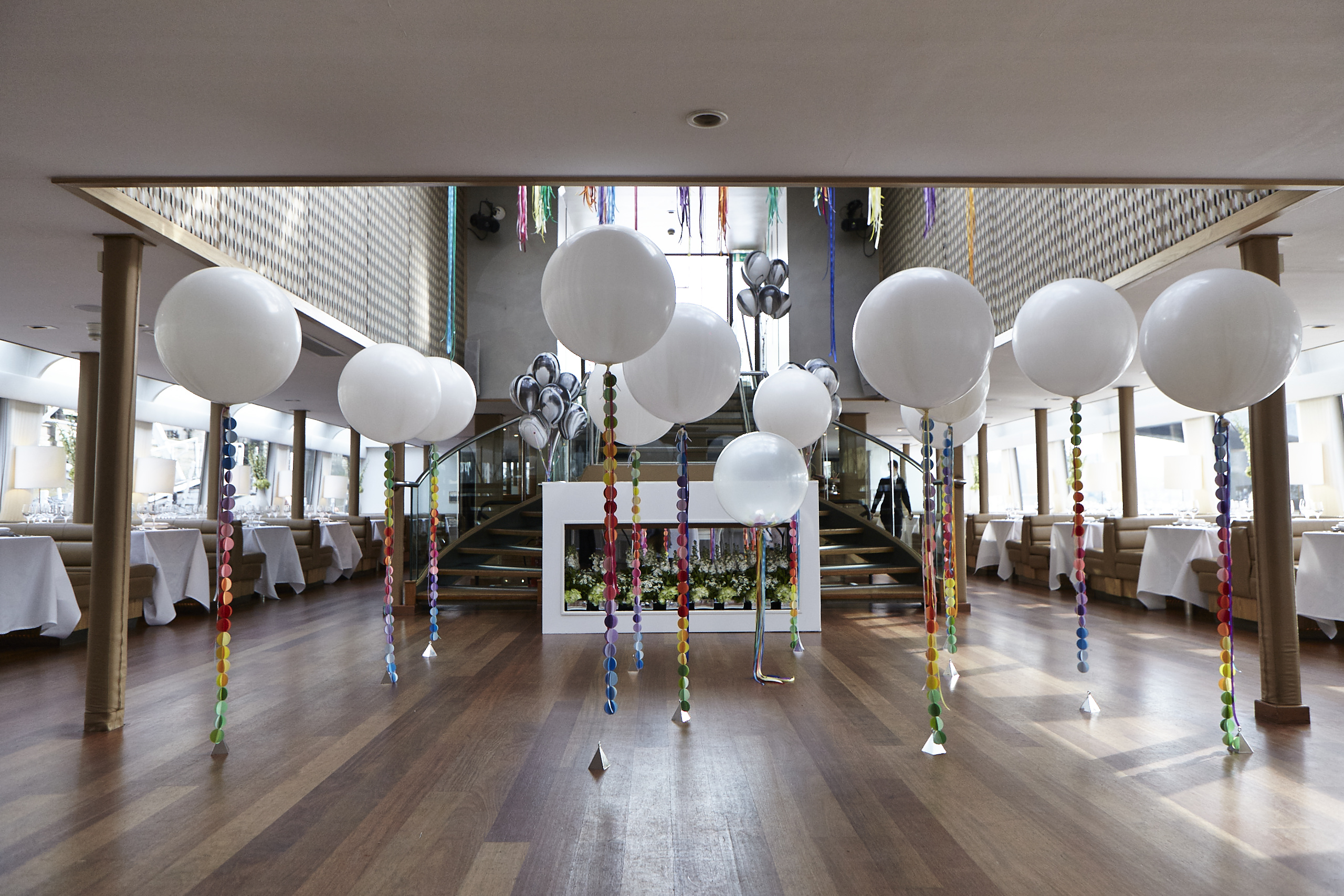 Silver Sturgeon event space with white balloons, perfect for weddings and parties.