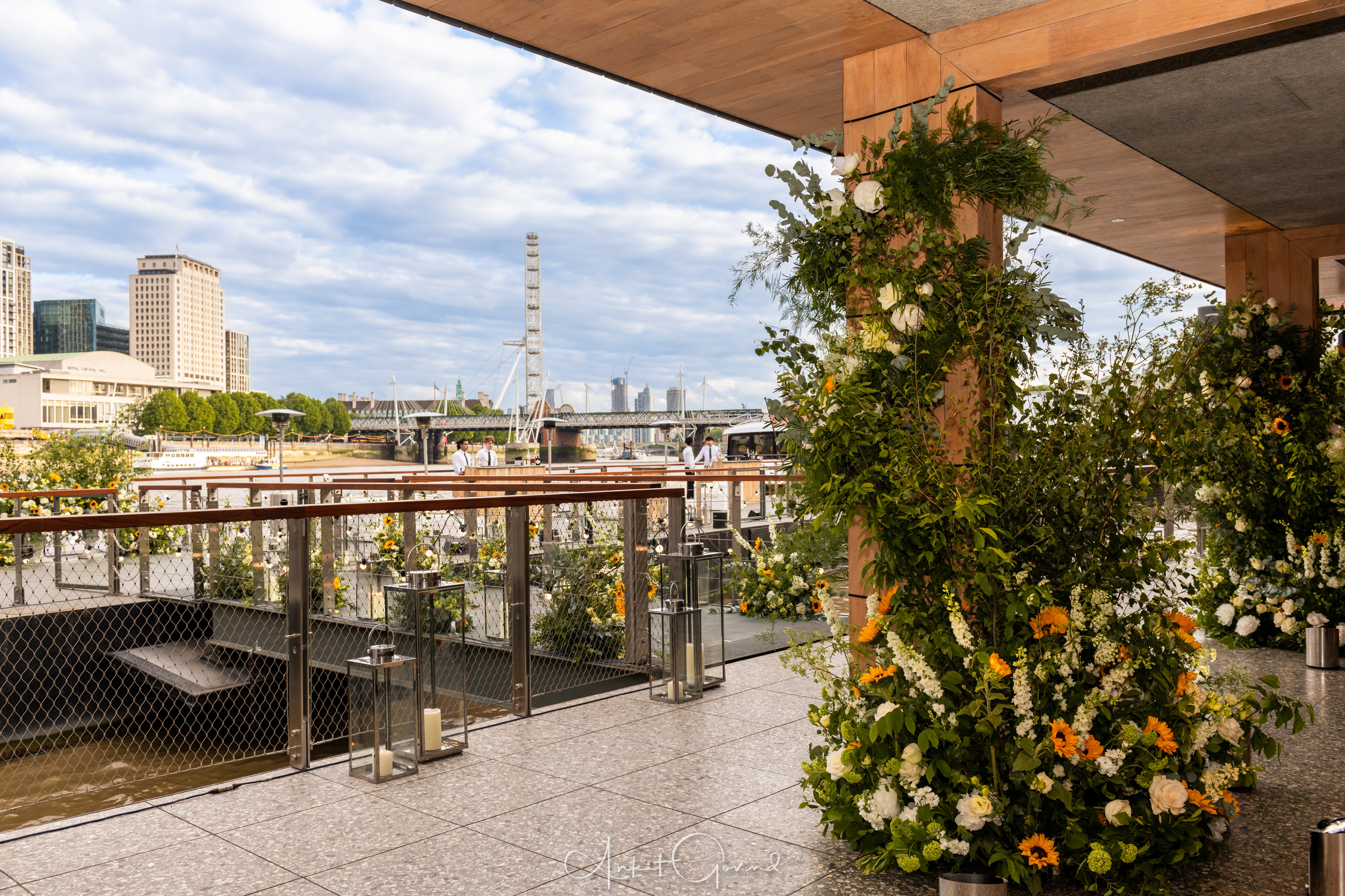 Woods Quay outdoor event space with floral arrangements, perfect for weddings and gatherings.