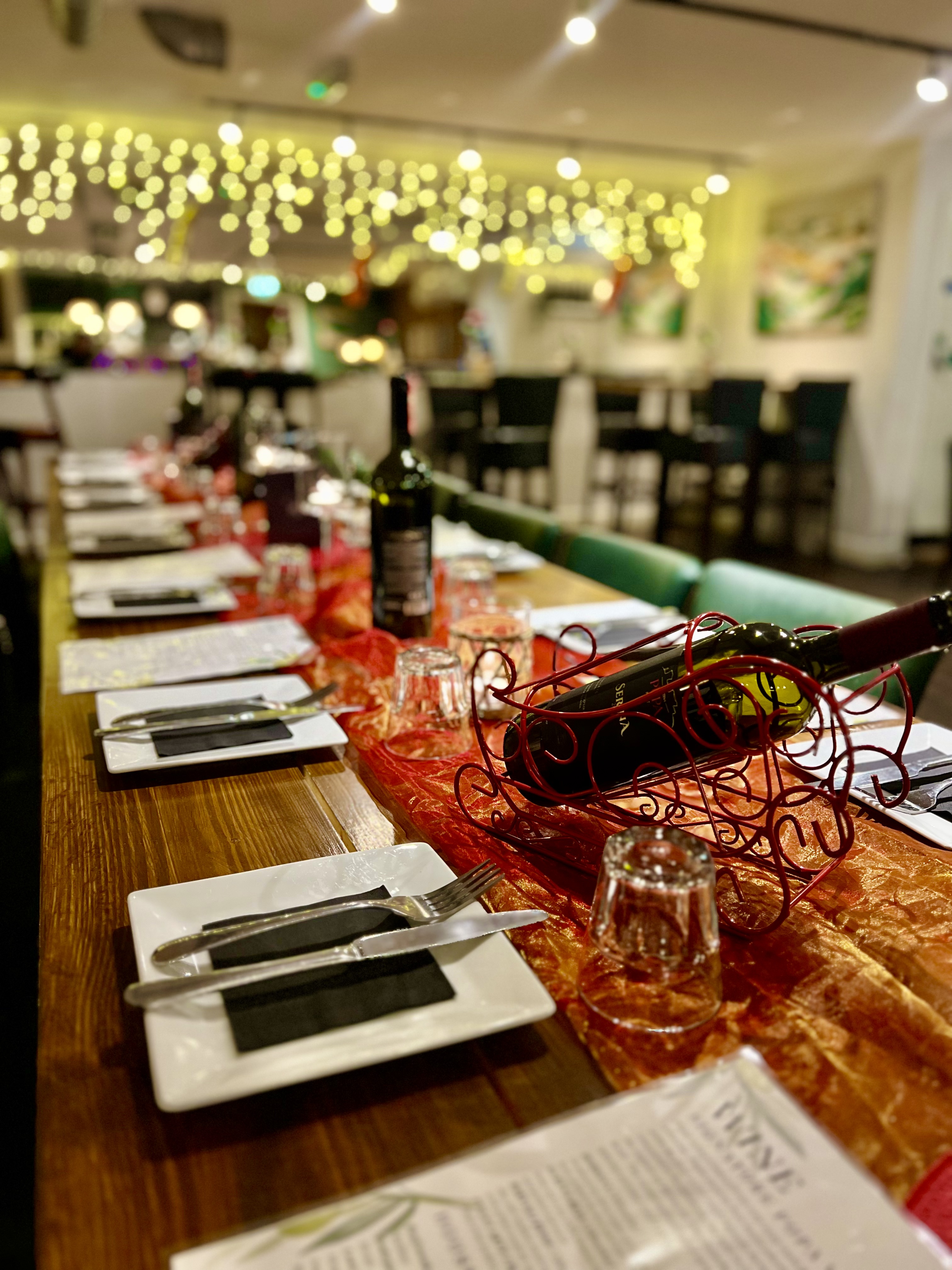 Elegant dining table at PUPA Restaurant, perfect for celebrations and gatherings.