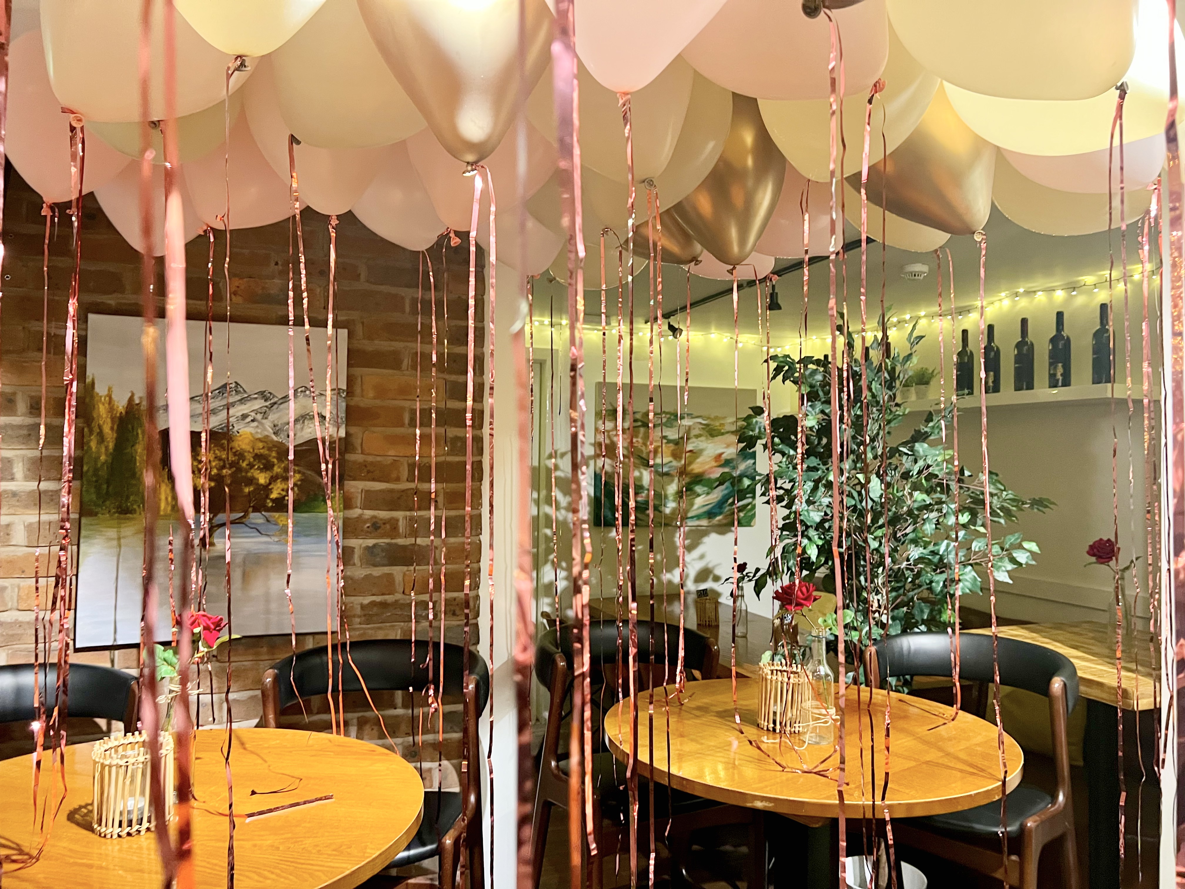 Elegant event space at PUPA Restaurant with balloons, ideal for celebrations and gatherings.